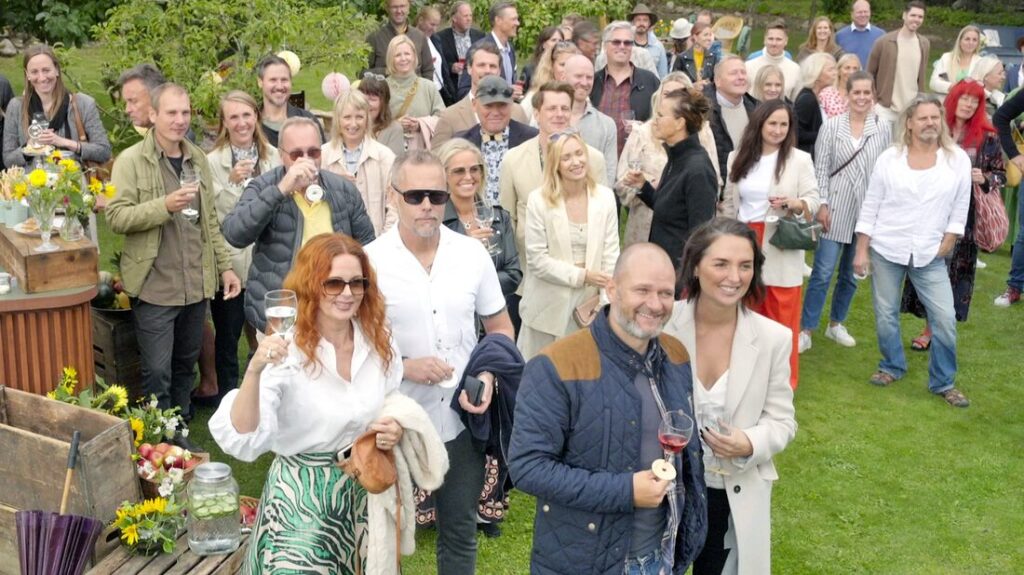Stylish - A group of people posing for a picture in a beautiful garden.