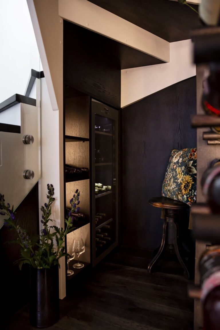 Temperate wine room under a staircase